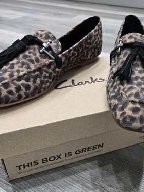 Clarks Pure2 Tassel Loafers in a leopard print suede finish